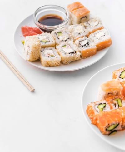 Angle Shot of Sushi Plates with Soy Sauce – Free Download