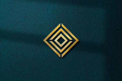 Embossed Gold Logo Mockup on Dark Green Texture Background with Shadow – Free Download