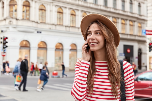 Charming Female Traveler in Urban Setting | Free Stock Photo Download