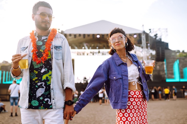 Couple Enjoying Beer at a Summer Beach Music Festival – Free Stock Photo for Download