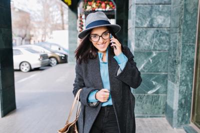 Joyful Young Businesswoman Walking in the City – Smiling and Speaking on the Phone | Free Stock Photo, Download Free