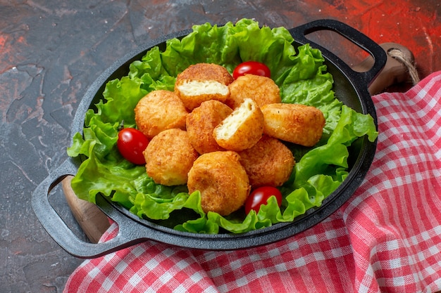 Delicious Chicken Nuggets with Lettuce and Cherry Tomatoes on Dark Red Background – Free Download