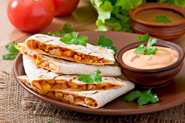 Mexican Quesadilla Sliced with Vegetables and Sauces – Free Download