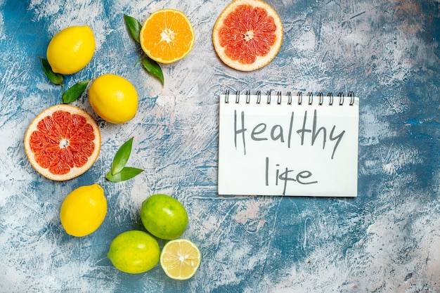 Healthy Life Notepad with Top View Cut Grapefruits and Lemons – Free Download