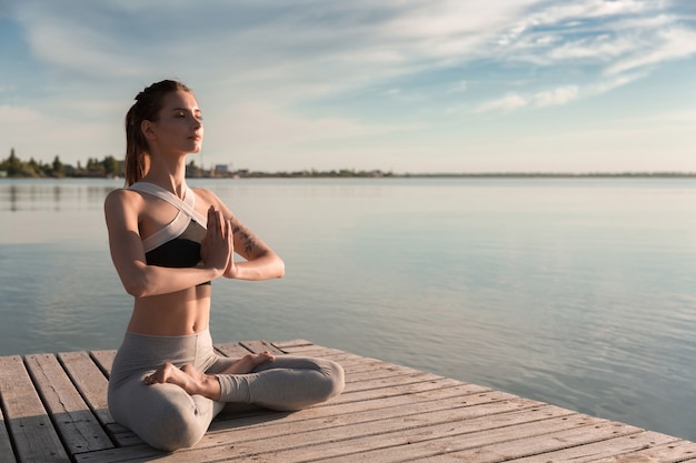 Young Sports Lady Meditating at the Beach – Free Stock Photo, Download for Free