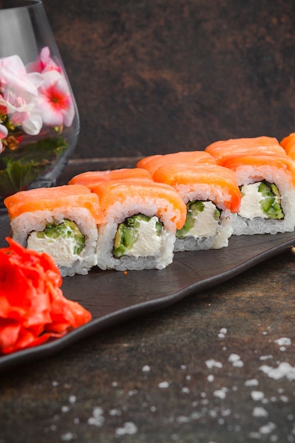 Side View Sushi Set with Pickled Ginger on a Dark Plate – Free Download