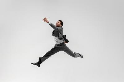 Happy Businessman Dancing in Motion – A Concept of Flexibility and Grace in the Office Environment for Free Download