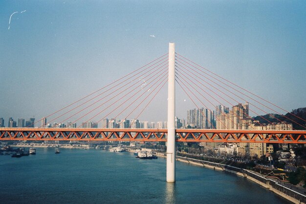 Suspension Bridge Over River Against Clear Blue Sky – Free Stock Photo for Download