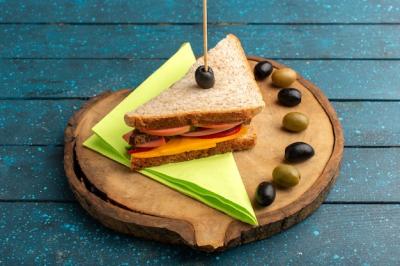 Tasty Cheese and Ham Sandwich with Olives on a Blue Wooden Desk – Free Download