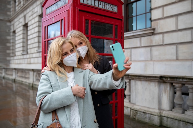 Tourists Exploring the City in Travel Masks – Free Download