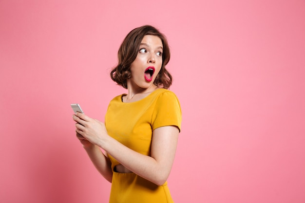 Surprised Young Woman Holding Mobile Phone – Free Stock Photo, Download Free