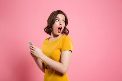 Surprised Young Woman Holding Mobile Phone – Free Stock Photo, Download Free