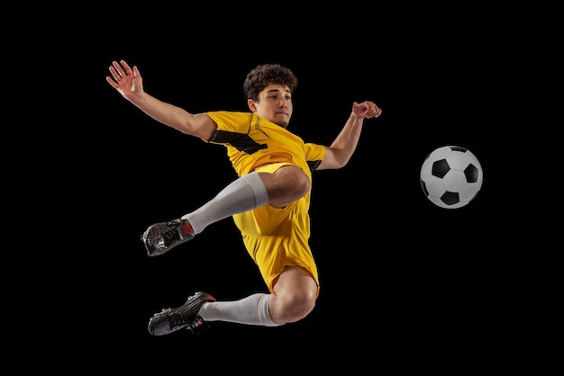 Young Man Kicking a Football in Motion – Free Stock Photo for Download