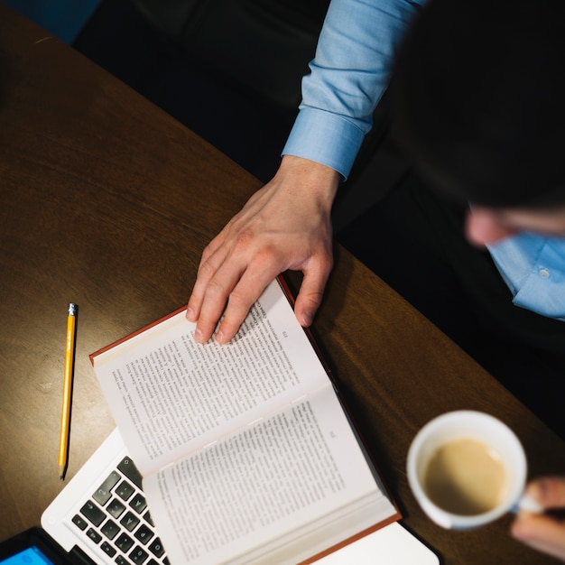 Man Studying and Drinking from Above – Free Stock Photo, Download Free