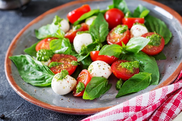 Caprese Salad: Tasty and Healthy Vegetarian Meal with Cherry Tomatoes, Mozzarella Balls, and Basil – Free Download