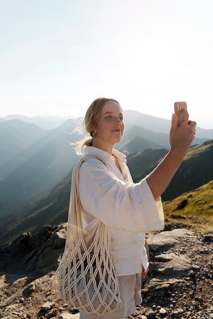 Woman Taking Selfie on a Mountain – Free Stock Photo for Download