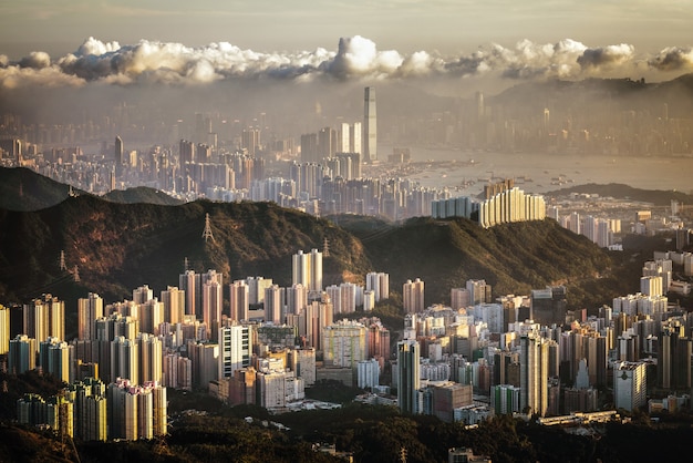 Aerial View of City Buildings Under Cloudy Sky – Free Download