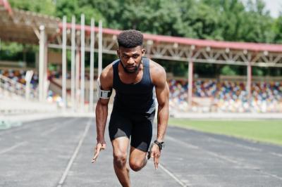 African American Male Athlete Racing on a Track – Free Stock Photo for Download