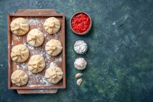 Raw Dumplings with Meat on Dark Background – Free Download