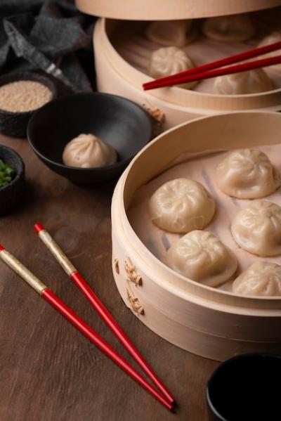 High Angle of Asian Dumplings with Chopsticks – Free Download