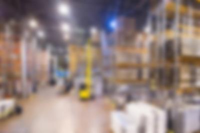 Blurred Background of a Large Modern Warehouse – Free Download