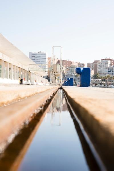 Diminishing Perspective of Water Canal Near the Dock – Free Stock Photo for Download