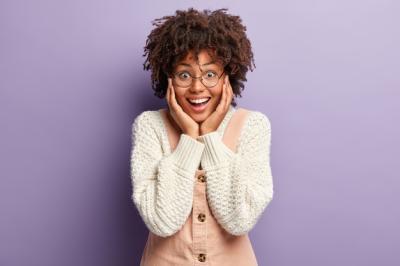 Overjoyed Afro American Female Expressing Happiness with Gift – Free Download