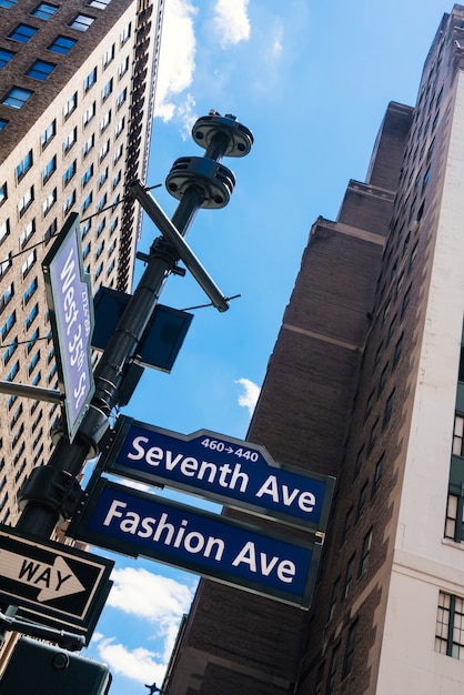 Manhattan Street Signs and Skyscrapers from Below – Free Download