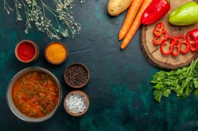 Delicious Vegetable Soup with Seasonings on Green Surface – Free Stock Photo for Download