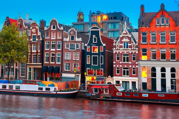 Stunning Night City View of Amsterdam Canal with Dutch Houses and Boats – Free Download