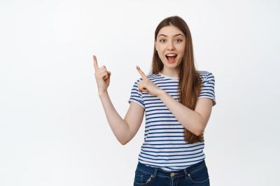 Happy Young Woman Pointing at Product in White Background – Free Download