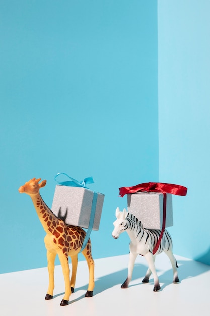 Giraffe and Zebra Toys Carrying Presents – Free Stock Photo for Download