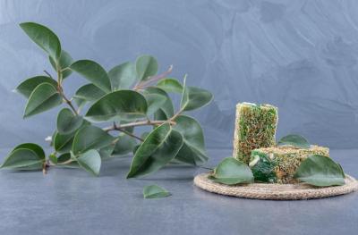 Turkish Delight Rahat Lokum with Hazelnuts and Decorative Leaves on Grey Background – Free Stock Photo Download