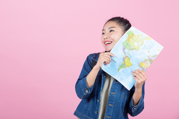 Female Tourists in a Studio on a Pink Background – Free Download