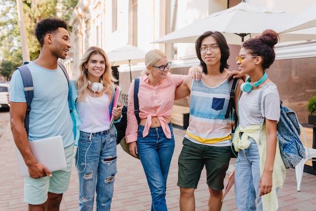 Blissful Friends Discussing Exams Outdoors – Free Stock Photo for Download