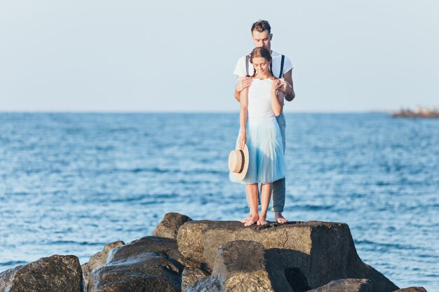 Happy Young Romantic Couple Relaxing on the Beach at Sunset – Free Download