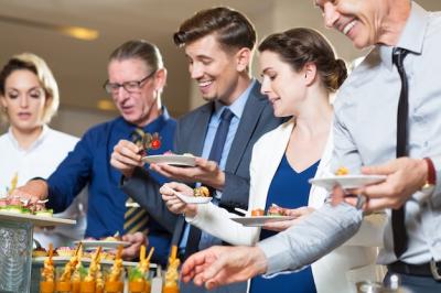 Happy Business People Enjoying a Buffet – Free Stock Photo for Download