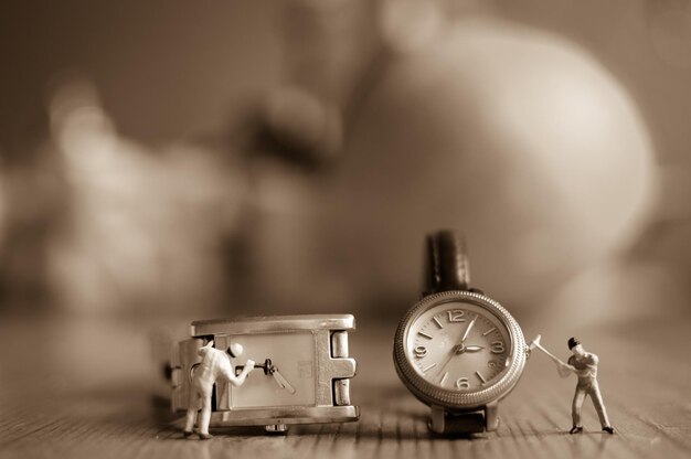 Close-up of Figurines and Wristwatches on Table – Free Stock Photo for Download