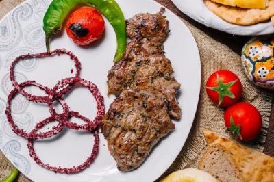 Meat Basturma Kebab on Grill with Tomato, Hot Pepper, and Onion in Sumac – Free Download