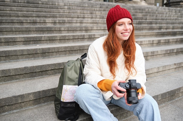 Young Student Photographer Reviewing Shots on Street Stairs – Free Stock Photo, Download for Free