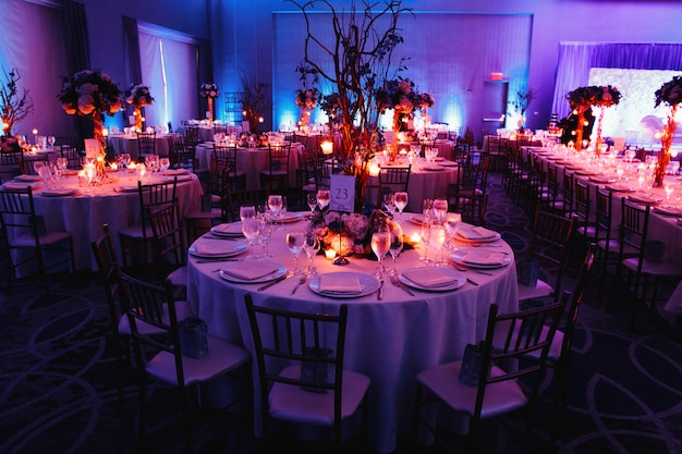 Decorated Wedding Hall with Candles, Round Tables, and Centerpieces – Free Download