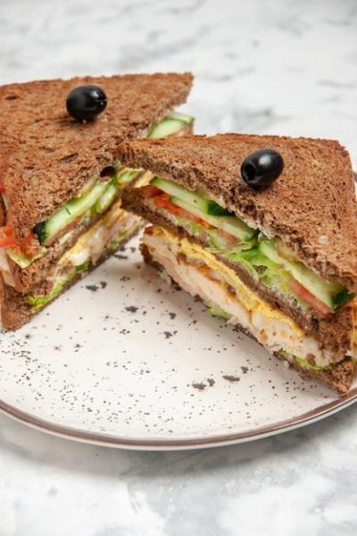 Delicious Black Bread Sandwich with Olive on a Stained Surface – Free Download