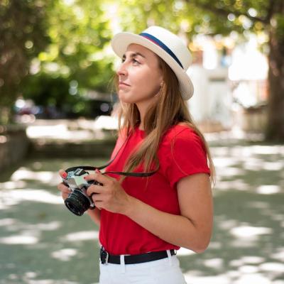 Mid Shot of a Woman with Hat and Camera – Free Stock Photo for Download