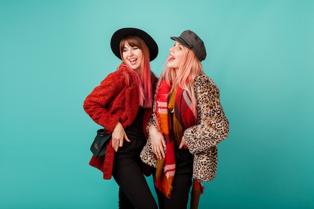 Beautiful Women in Stylish Faux Fur Coats Against Turquoise Wall – Free Stock Photo, Download Free