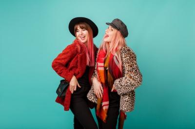 Beautiful Women in Stylish Faux Fur Coats Against Turquoise Wall – Free Stock Photo, Download Free