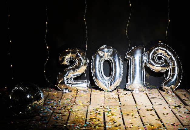 Balloons and Disco Ball Surrounded by Confetti – Free Stock Photo for Download