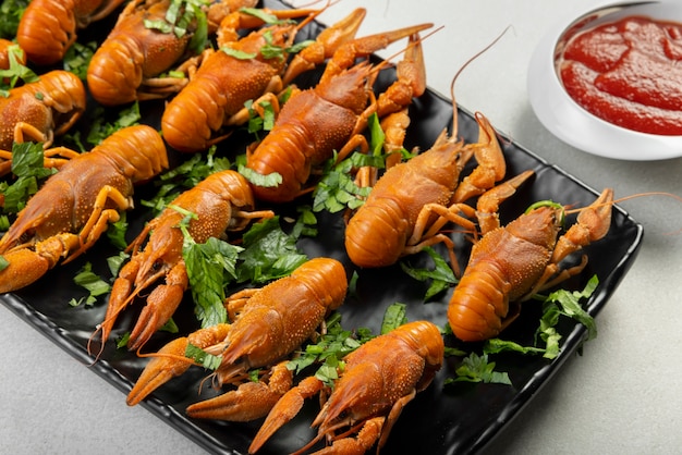 Crawfish with Herbs on Black Plate – Free Stock Photo for Download