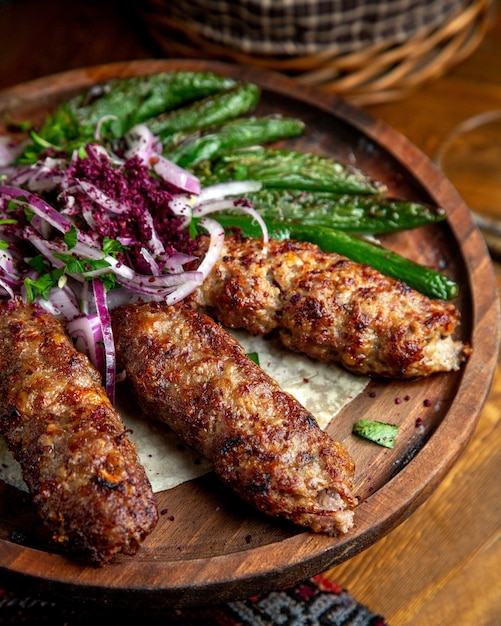 Delicious Lula Kebab with Red Onions and Grilled Green Chili Peppers – Free Download