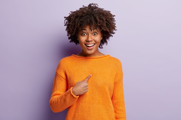 Happy Dark Skinned Young Lady in Orange Casual Jumper – Free Stock Photo for Download