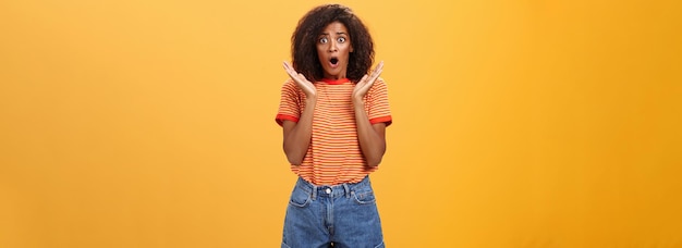 Worried African American Sister with Curly Hair in Trendy Striped T-Shirt – Free Download